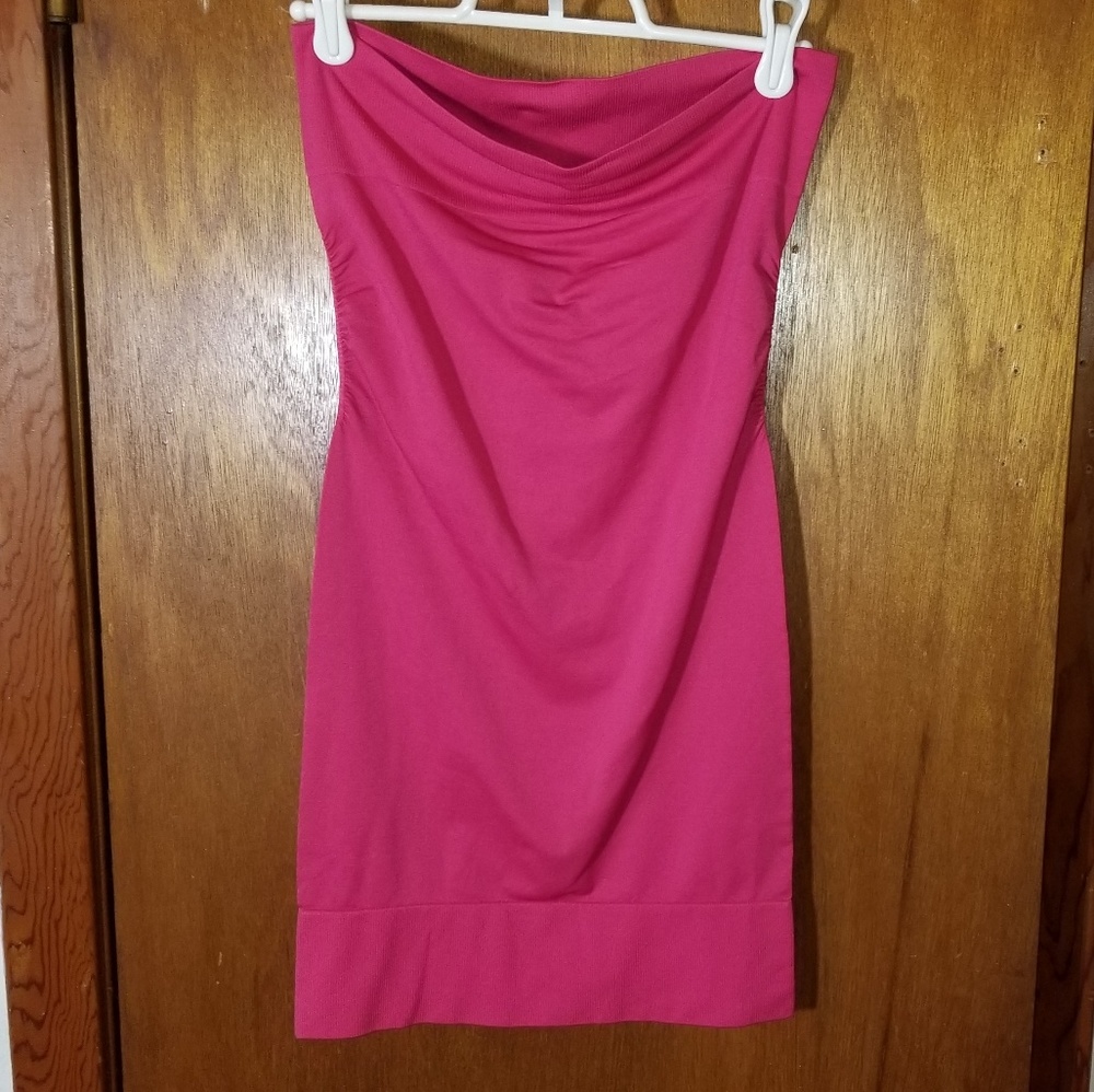 "Ha ya right" I'll never fit this  lil pink dress